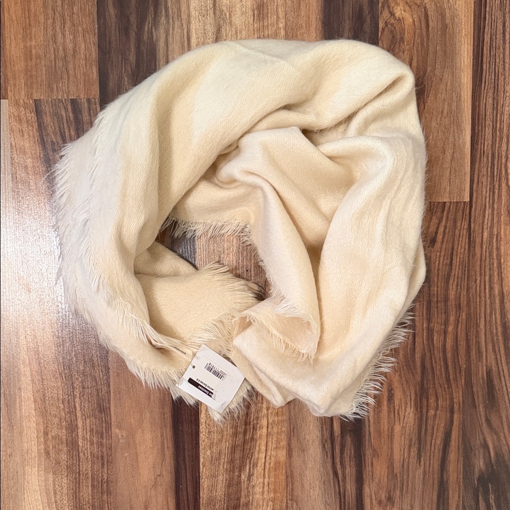 NWT Elegant Cream Fringed Scarf. This scarf soft and has a cashmere like feel.